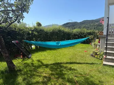 a blue hammock in the yard of a house at Resting in Sauda