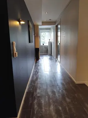 an empty hallway with a tile floor in a house at Apartment in Stryn in Stryn
