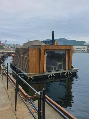 a house on a dock on a body of water at You cottage in the city in Bergen