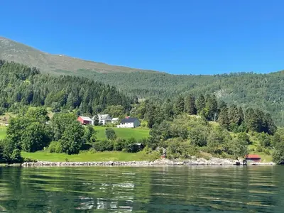 a house on the shore of a body of water at Spacious House with Fjordview in Lauvstad