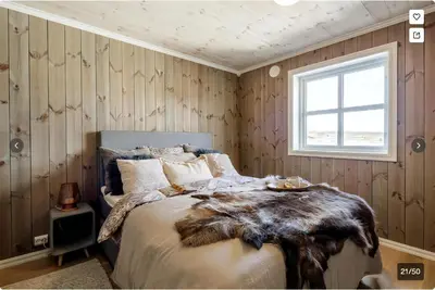 a bedroom with a bed and a window at Modern Mountain Escape in Beitostøl