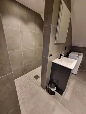 a bathroom with a sink and a mirror at Central Studio for 2 in Trondheim