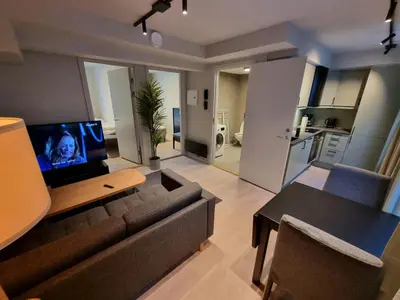 a living room with a couch and a table at Central Apartment for 4 in Trondheim