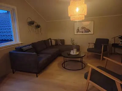 a living room with a couch and a table at Villa Varden 10 min from Bergen sentrum in Bergen