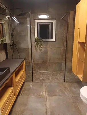 a bathroom with a shower with a toilet and a sink at Villa Varden 10 min from Bergen sentrum in Bergen