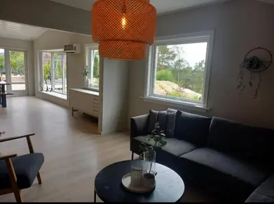 a living room with a couch and a table at Villa Varden 10 min from Bergen sentrum in Bergen