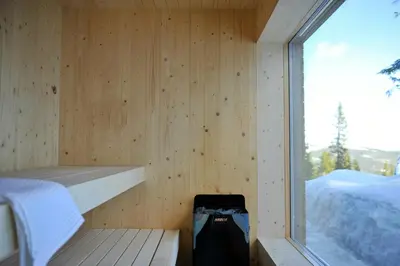 a sauna with a bed and a window at Modern Family Cabin With Trysil Mountain Views in Trysil