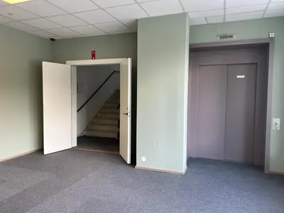 an open door in an empty room with stairs at Åndalsnes House---Apartments in Åndalsnes