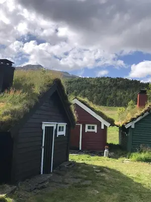 a couple of buildings with a grass roof at Stall Rygg Mountain Cottage, Gloppen
