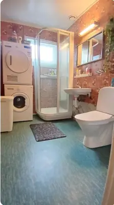 a bathroom with a toilet and a sink and a shower at Stryn Norway in Stryn