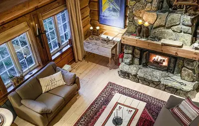 an overhead view of a living room with a stone fireplace at 4 Bedroom Gorgeous Home In Hovden I Setesdal in Hovden