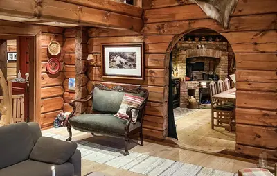 a living room with a chair in a log cabin at 4 Bedroom Gorgeous Home In Hovden I Setesdal in Hovden