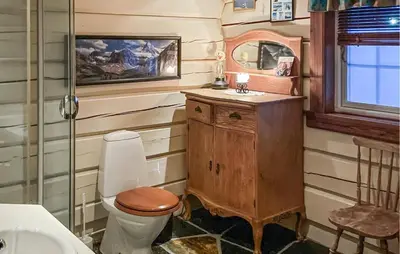 a bathroom with a toilet and a sink at 4 Bedroom Gorgeous Home In Hovden I Setesdal in Hovden