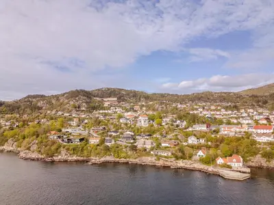 an aerial view of a town on a river at Panoramic view with private terrace in Bergen