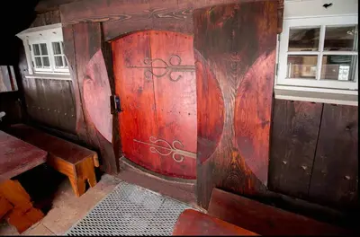 a wooden door in a room with a window at Family Cabin For Many In The High Mountains in Hovet