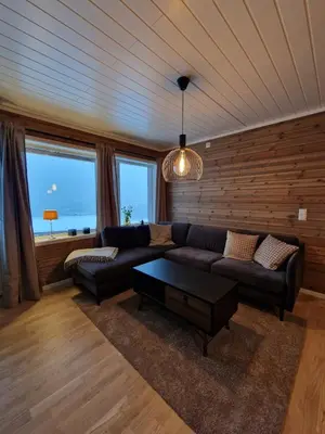 a living room with a couch and a table at Apartment in Voss - Tråstølen in Skulestadmo