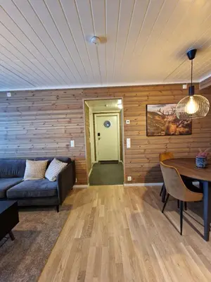 a living room with a couch and a table at Apartment in Voss - Tråstølen in Skulestadmo
