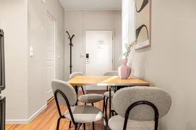 a dining room with a table and chairs at Heimby Homes - Seaside Balcony Stay in Bergen