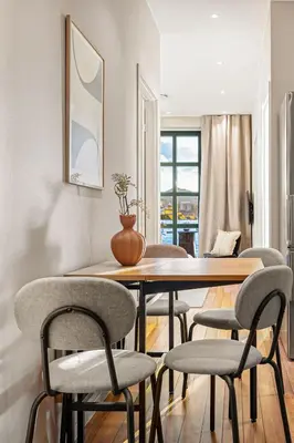 a dining room with a table and chairs at Heimby Homes - Seaside Balcony Stay in Bergen