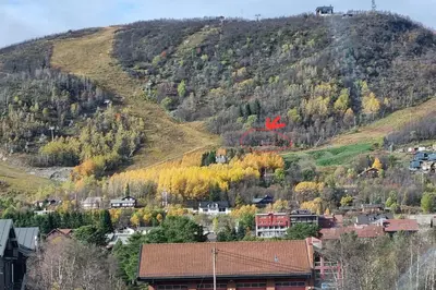 a town on a hill with a mountain at Bloksberg - cabin with amazing view and ski inn-out in Geilo