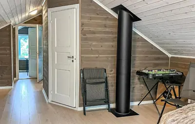 a room with a black pipe on the wall at 4 Bedroom Gorgeous Home In Edland in Vågsli