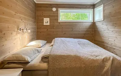 a bedroom with a bed and a window at 4 Bedroom Gorgeous Home In Edland in Vågsli