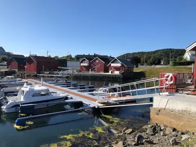 a group of boats are docked at a marina at Two floors house with 3 bed rooms and room for 8 persons in Ålesund