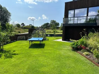 a blue ping pong table in the middle of a yard at Modern house - perfect for holidays in Bergen in Bergen