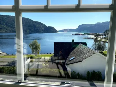 a view of a lake from a window at The View in Sauda