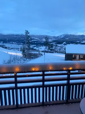 a winter view from a balcony with snow at Flott leilighet på Voss i Tråstølsvegen med 3 soverom 6 sengeplasser in Skulestadmo