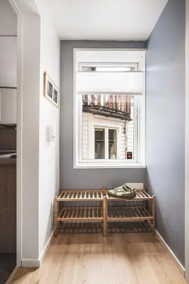 a room with a bench in front of a window at Bergen pearl in historic street & easy check-in in Bergen