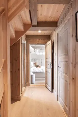 a hallway leading to a bedroom with a bed at The national park is calling! in Garden