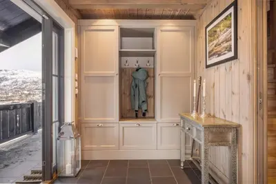 a home hallway with a closet and a table at The national park is calling! in Garden