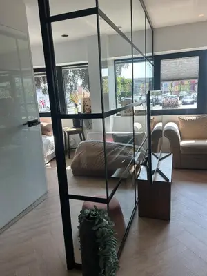 a room with a living room with a glass wall at Holiday apartment south Norway in Lii