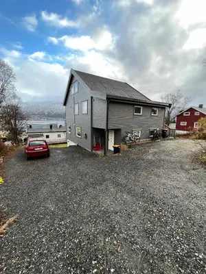 a house with a car parked in a driveway at Nice little studio centrally located in Lii