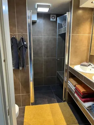 a bathroom with a shower and a sink at Villa chaimae in Lii