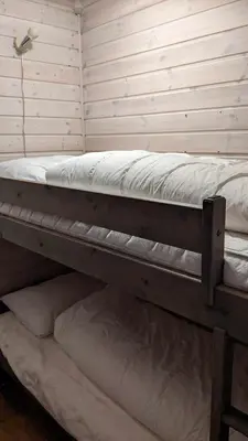 a room with two bunk beds in it at Ski-In, Ski-Out apartment at Filefjell in Tyinkrysset