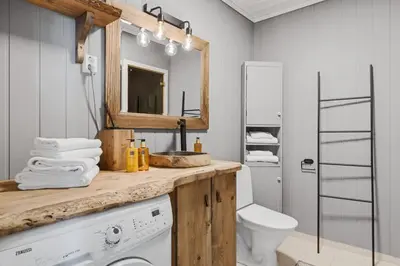 a bathroom with a sink and a toilet and a mirror at Trysilfjell 786 by Vacation Trysil in Trysil