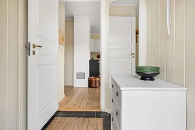 a kitchen with a white door and a green bowl on a counter at Trysilfjell 782 by Vacation Trysil in Trysil