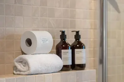 a bathroom with two bottles of wine and a towel at Trysilfjell 636 by Vacation Trysil in Trysil