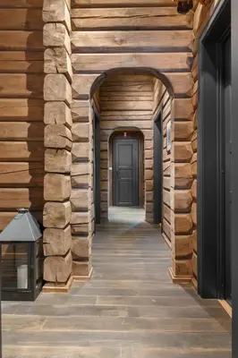 an empty hallway with wooden walls and a door at Trysilfjell 636 by Vacation Trysil in Trysil