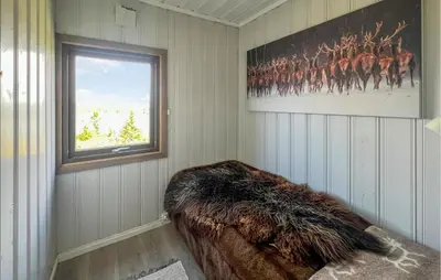 a room with a window and a couch in the corner at 3 Bedroom Stunning Home In Lillehammer in Lillehammer