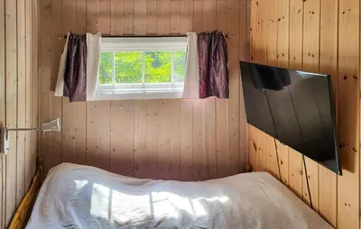 a room with a bed and a window at 2 Bedroom Nice Home In Hafjell in Hafjell