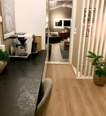 a hallway of a living room with a kitchen and a living room at Trivelig lite hus in Lii