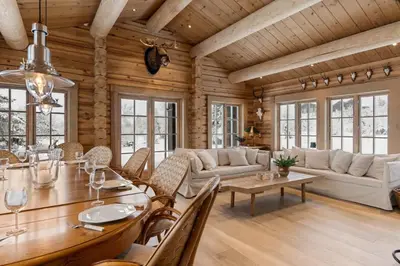 a living room with a table and chairs and a couch at Trysilfjell 25 by Vacation Trysil in Trysil