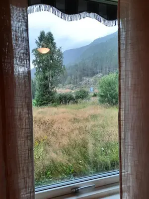 a window with a view of a field at Holiday Home Garnås in Nesbyen