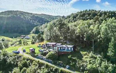 an aerial view of a house in the mountains at Stunning Home In Lavik in Lavik
