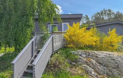 a house with a wooden ramp leading up to a house at 3 Bedroom Gorgeous Home In Kolbeinsvik in Kolbeinsvik