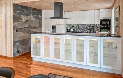 a kitchen with white cabinets and a counter top at Pet Friendly Home In Eidsvåg I Romsdal in Eidsvåg