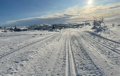 a snow covered road with tracks in the snow at Awesome Home In Trysil With Sauna in Trysil